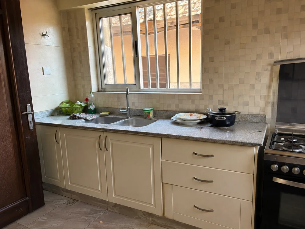 Used dishes and cooking splashes in a kitchen before cleaning